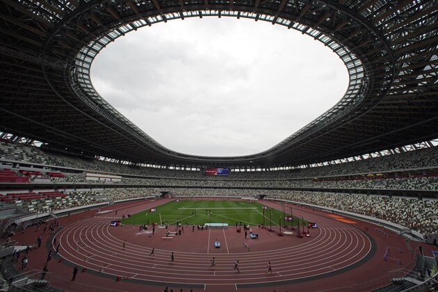 Athletes compete in the men's 400-meter T20 race during an athletics test event for the Tokyo 2020 Paralympics Games at National Stadium in Tokyo, Tuesday, May 11, 2021. (AP Photo/Shuji Kajiyama)