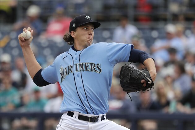 Seattle Mariners starting pitcher Logan Gilbert throws against the Los Angeles Angels in the first inning during a spring training baseball game Tuesday, March 10, 2020, in Peoria, Ariz. (AP Photo/Elaine Thompson)