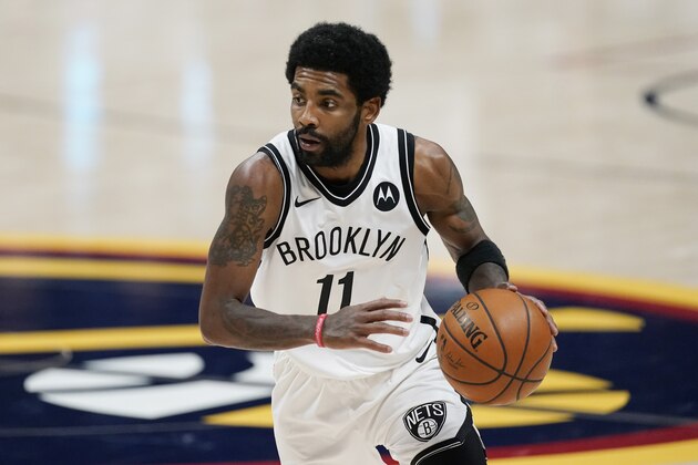 Brooklyn Nets guard Kyrie Irving (11) in the second half of an NBA basketball game Saturday, May 8, 2021, in Denver. (AP Photo/David Zalubowski)