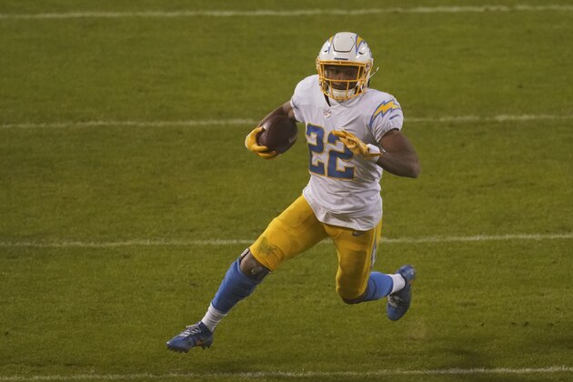 Los Angeles Chargers running back Justin Jackson runs up field during the second half of an NFL football game against the Kansas City Chiefs, Sunday, Jan. 3, 2021, in Kansas City. (AP Photo/Charlie Riedel)