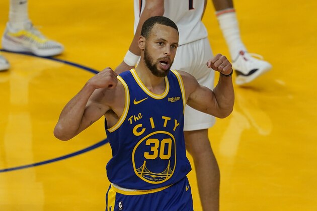 Golden State Warriors guard Stephen Curry (30) gestures after scoring and being fouled against the Phoenix Suns during the second half of an NBA basketball game in San Francisco, Tuesday, May 11, 2021. (AP Photo/Jeff Chiu)