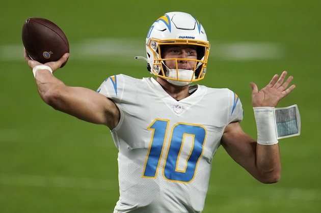 Los Angeles Chargers quarterback Justin Herbert #10 throws a pass during the second quarter against the Las Vegas Raiders in an NFL football game, Sunday, Dec. 13, 2020, in Las Vegas. (AP Photo/Jeff Bottari)