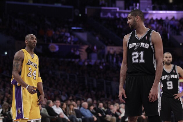 Los Angeles Lakers shooting guard Kobe Bryant and San Antonio Spurs center Tim Duncan during the first half of an NBA basketball game in Los Angeles, Thursday, Feb. 3, 2011. (AP Photo/Jae C. Hong)