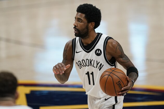 Brooklyn Nets guard Kyrie Irving (11) in the second half of an NBA basketball game Saturday, May 8, 2021, in Denver. (AP Photo/David Zalubowski)
