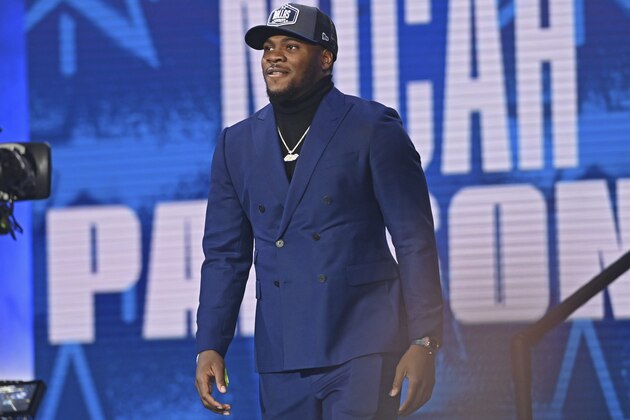 Penn State linebacker Micah Parsons walks down the runway after the was chosen with the twelfth overall pick by the Dallas Cowboys in the first round of the NFL football draft, Thursday, April 29, 2021, in Cleveland. (AP Photo/David Dermer)