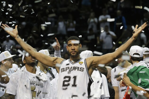 FILE - In this June 15, 2014, file photo, San Antonio Spurs forward Tim Duncan (21) celebrates after Game 5 of the NBA basketball finals in San Antonio. Duncan announced his retirement on Monday, July 11, 2016, after 19 seasons, five championships, two MVP awards and 15 All-Star appearances. It marks the end of an era for the Spurs and the NBA.  (AP Photo/David J. Phillip, File)