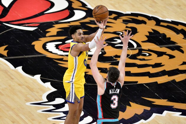 Golden State Warriors guard Jordan Poole shoots against Memphis Grizzlies guard Grayson Allen (3) in the second half of an NBA basketball game Saturday, March 20, 2021, in Memphis, Tenn. (AP Photo/Brandon Dill)