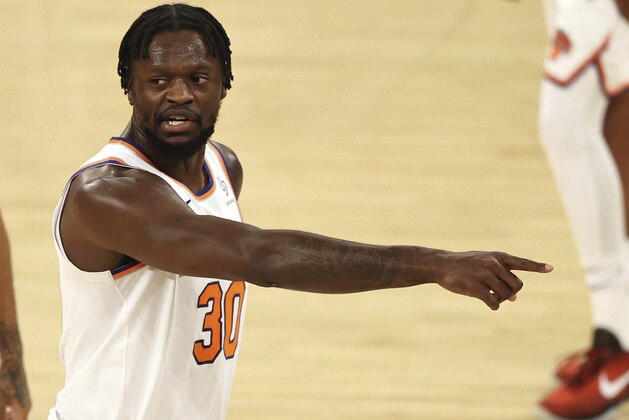 New York Knicks' Julius Randle directs his teammates in the second quarter of an NBA basketball game against the Charlotte Hornets at Madison Square Garden, Saturday, May 15, 2021, in New York. (Elsa/Pool Photo via AP)