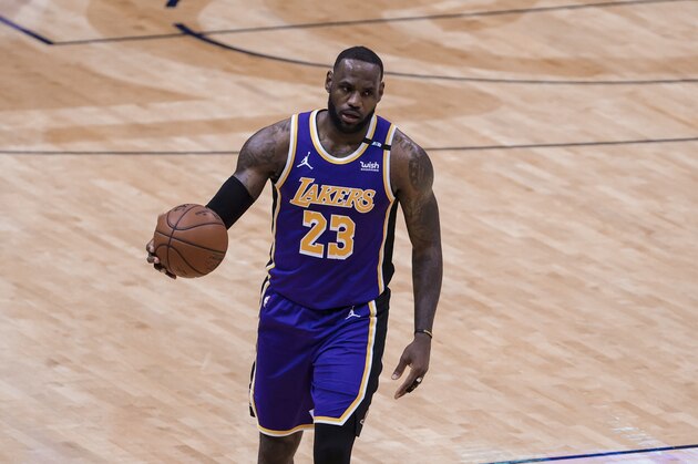 Los Angeles Lakers forward LeBron James (23) drives with the ball against the New Orleans Pelicans in the second quarter of an NBA basketball game in New Orleans, Sunday, May 16, 2021. (AP Photo/Derick Hingle)