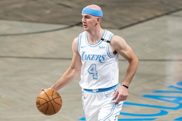 Los Angeles Lakers guard Alex Caruso (4) dribbles down court in the second half of an NBA basketball game, Saturday, April 10, 2021, in New York. (AP Photo/Corey Sipkin)