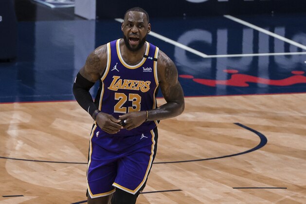 Los Angeles Lakers forward LeBron James (23) celebrates after scoring against the New Orleans Pelicans in the third quarter of an NBA basketball game in New Orleans, Sunday, May 16, 2021. (AP Photo/Derick Hingle)