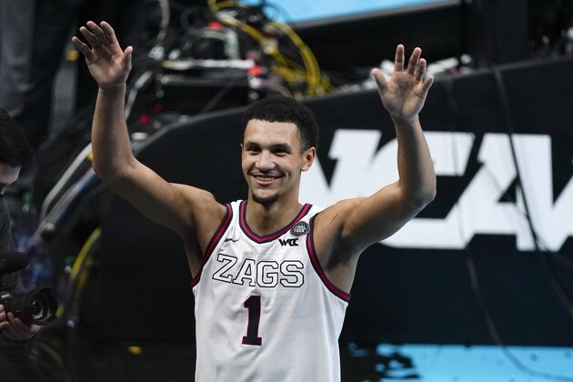 Gonzaga guard Jalen Suggs (1) celebrates making the game winning basket against UCLA during overtime in a men's Final Four NCAA college basketball tournament semifinal game, Saturday, April 3, 2021, at Lucas Oil Stadium in Indianapolis. Gonzaga won 93-90. (AP Photo/Michael Conroy)