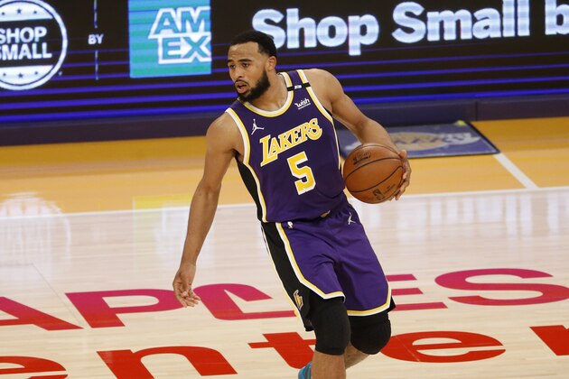 Los Angeles Lakers' Talen Horton-Tucker (5) dribbles against the Boston Celtics during the second half of an NBA basketball game, Thursday, April 15, 2021, in Los Angeles. The Boston Celtics won 121-113. (AP Photo/Ringo H.W. Chiu)