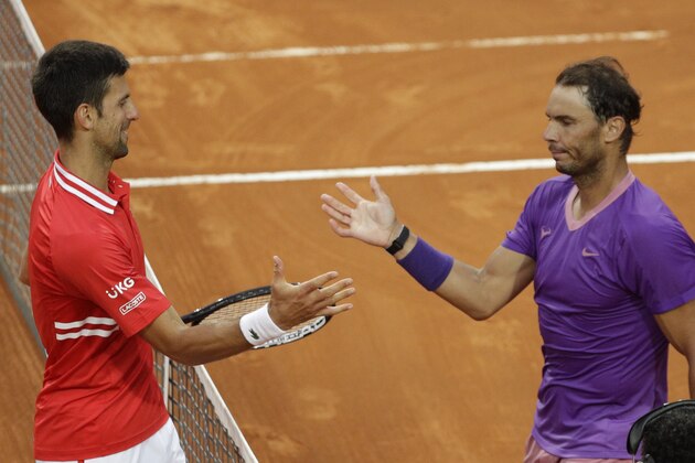 Spain's Rafael Nadal, right, greets Serbia's Novak Djokovic after deleting him at their final match of the Italian Open tennis tournament, in Rome, Sunday, May 16, 2021. Nadal won 7-5, 1-6, 6-3. (AP Photo/Gregorio Borgia)