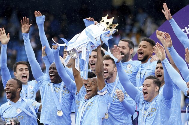 Manchester City's Fernandinho raises the trophy to celebrate winning the English Premier League title after the soccer match between Manchester City and Everton at the Etihad stadium in Manchester, Sunday, May 23, 2021.(AP Photo/Dave Thompson, Pool) Manchester City's Fernandinho raises the trophy to celebrate winning the English Premier League title after the soccer match between Manchester City and Everton at the Etihad stadium in Manchester, Sunday, May 23, 2021.(AP Photo/Dave Thompson, Pool)
