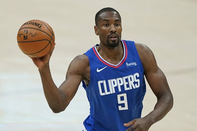 Los Angeles Clippers' Serge Ibaka looks to pass in the second half of an NBA basketball game against the Cleveland Cavaliers, Wednesday, Feb. 3, 2021, in Cleveland. (AP Photo/Tony Dejak)