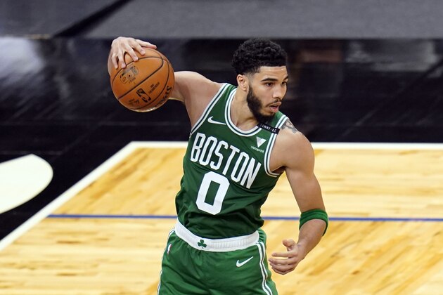 Boston Celtics forward Jayson Tatum (0) grabs a rebound during the second half of an NBA basketball game against the Orlando Magic, Wednesday, May 5, 2021, in Orlando, Fla. (AP Photo/John Raoux)