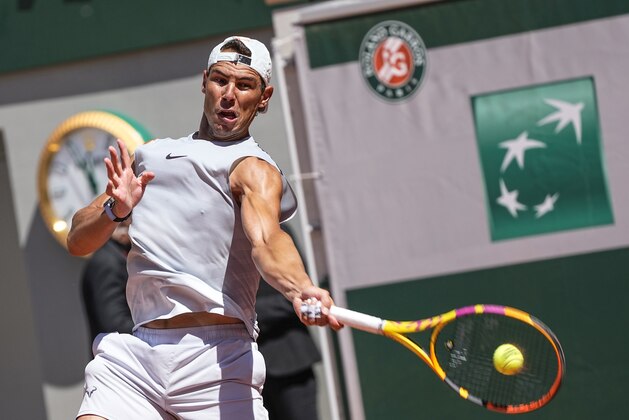 Spain's Rafael Nadal returns the ball during a training session at Roland Garros stadium ahead of the French Open tennis tournament in Paris, Thursday, May 27, 2021. (AP Photo/Michel Euler)