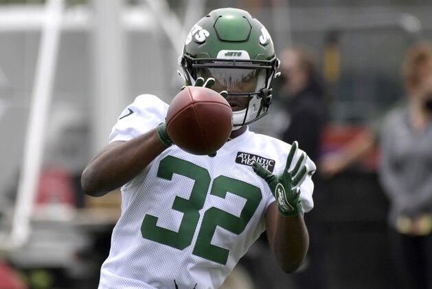 New York Jets fourth-round draft pick Michael Carter works out during NFL football rookie camp, Friday, May 7, 2021, in Florham Park, N.J. (AP Photo/Bill Kostroun)
