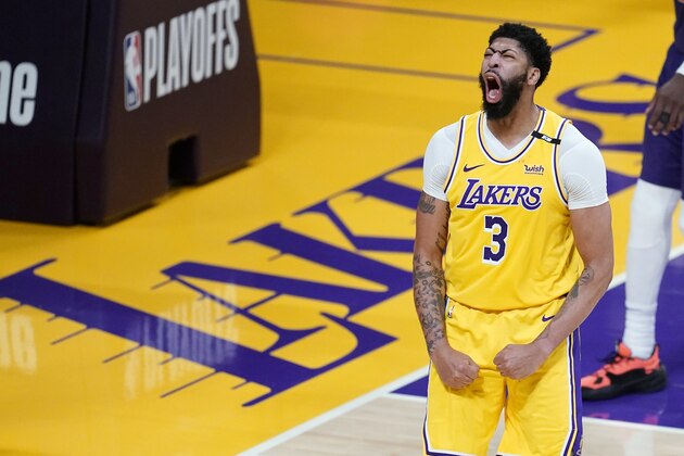 Los Angeles Lakers forward Anthony Davis celebrates after scoring during the second half in Game 3 of the team's NBA basketball first-round playoff series against the Phoenix Suns on Thursday, May 27, 2021, in Los Angeles. (AP Photo/Marcio Jose Sanchez)