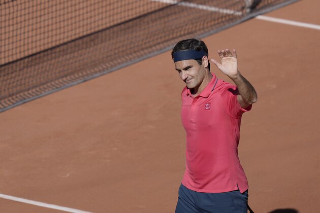 Switzerland's Roger Federer waves to the crowd after defeating Uzbekistan's Denis Istomin during their first round match on day two of the French Open tennis tournament at Roland Garros in Paris, France, Monday, May 31, 2021. (AP Photo/Thibault Camus)