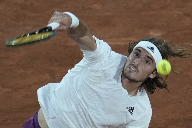 Stefanos Tsitsipas of Greece serves the ball to Jeremy Chardy of France during their first round match of the French Opn tennis tournament at the Roland Garros stadium Sunday, May 30, 2021 in Paris. (AP Photo/Christophe Ena)