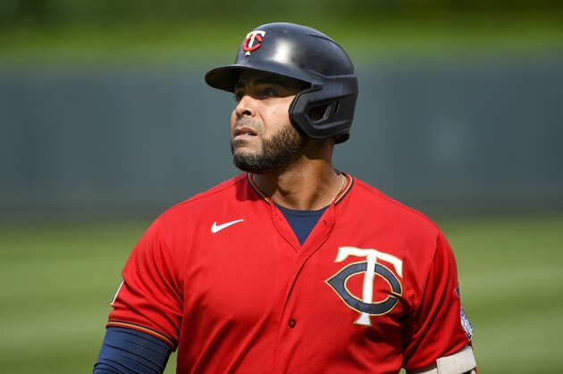 Minnesota Twins designated hitter Nelson Cruz walks back to the dug out after hitting a pop fly for an out against the Oakland Athletics during the ninth inning of a baseball game, Sunday, May 16, 2021, in Minneapolis. The Athletics won 7-6. (AP Photo/Craig Lassig)