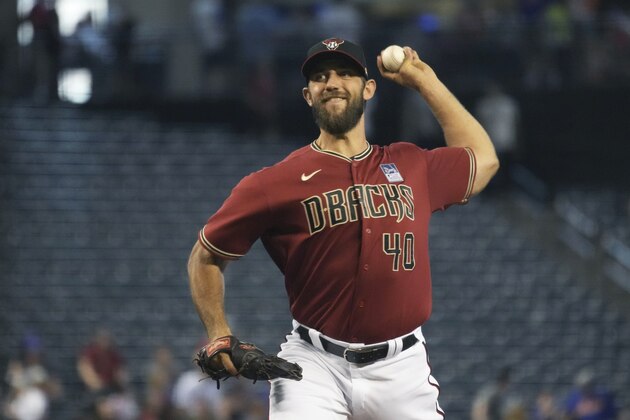 Arizona Diamondbacks pitcher Madison Bumgarner throws against the New York Mets in the first inning during a baseball game, Wednesday, June 2, 2021, in Phoenix. (AP Photo/Rick Scuteri)