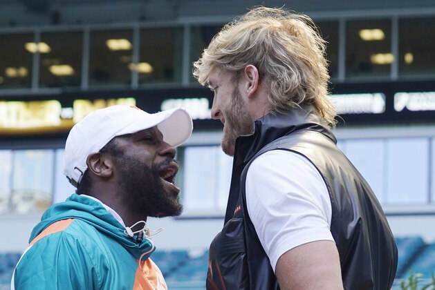 Boxers Floyd Mayweather and Logan Paul taunt each other during a news conference Thursday, May 6, 2021, in Miami Gardens, Fla. Mayweather and Paul are scheduled to face off in an exhibition bout June 6. (AP Photo/Marta Lavandier)