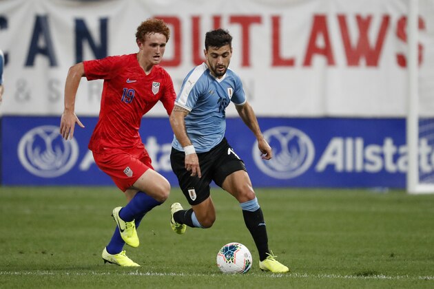 Uruguay's Giorgian De Arrascaeta, right, controls the ball as United States' Josh Sargent (19) gives chase during the first half of a friendly soccer match Tuesday, Sept. 10, 2019, in St. Louis. (AP Photo/Jeff Roberson)