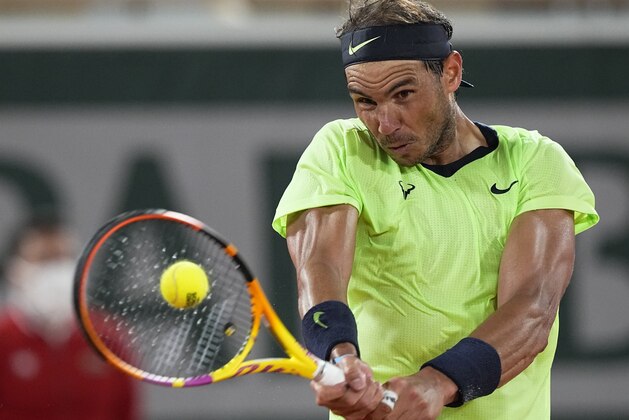 Spain's Rafael Nadal plays a return to Richard Gasquet of France during their second round match on day 5, of the French Open tennis tournament at Roland Garros in Paris, France, Thursday, June 3, 2021. (AP Photo/Michel Euler)