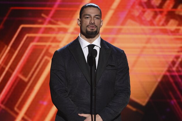 Roman Reigns presents the best coach award at the ESPY Awards on Wednesday, July 10, 2019, at the Microsoft Theater in Los Angeles. (Photo by Chris Pizzello/Invision/AP)
