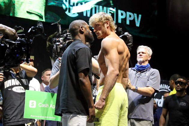MIAMI GARDENS, FLORIDA - JUNE 05: Floyd Mayweather and Logan Paul face off during the weigh-in ahead of the June 6th exhibition boxing match between Floyd Mayweather and Logan Paul on June 5, 2021 at Hard Rock Live at Seminole Hard Rock Casino in Miami Gardens, Florida. (Photo by Johnny Nunez/Getty Images)