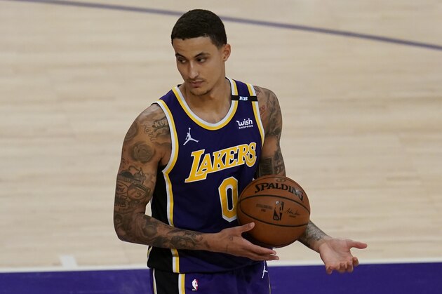 Los Angeles Lakers forward Kyle Kuzma (0) controls the ball during an NBA basketball game against the New York Knicks Tuesday, May 11, 2021, in Los Angeles. (AP Photo/Ashley Landis)