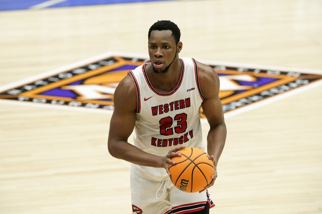 Western Kentucky center Charles Bassey looks to make a pass during an NCAA college basketball game against Louisiana Tech in the quarterfinals of the NIT, Thursday, March 25, 2021, in Frisco, Texas. (AP Photo/Tony Gutierrez)