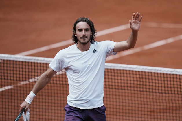 Stefanos Tsitsipas of Greece celebrates after defeating Spain's Pablo Carreno Busta during their fourth round match on day 8, of the French Open tennis tournament at Roland Garros in Paris, France, Sunday, June 6, 2021. (AP Photo/Thibault Camus)