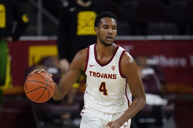 Southern California forward Evan Mobley (4) controls the ball during the second half of an NCAA college basketball game against Oregon Monday, Feb. 22, 2021, in Los Angeles. (AP Photo/Ashley Landis)