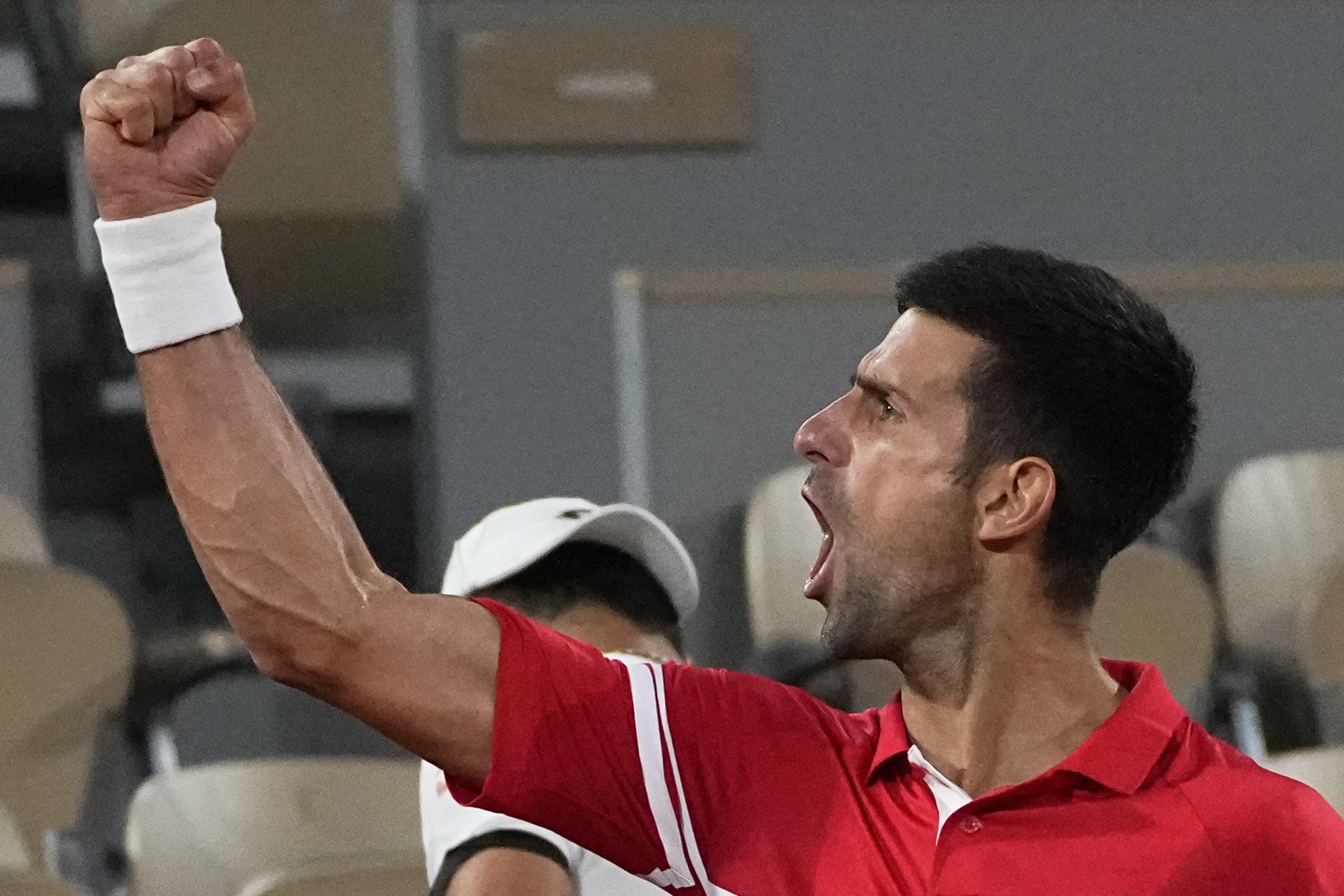 Serbia's Novak Djokovic reacts as he defeats Italy's Matteo Berrettini in a quarterfinal match of the French Open tennis tournament at the Roland Garros stadium Wednesday, June 9, 2021 in Paris. (AP Photo/Michel Euler) Serbia's Novak Djokovic reacts as he defeats Italy's Matteo Berrettini in a quarterfinal match of the French Open tennis tournament at the Roland Garros stadium Wednesday, June 9, 2021 in Paris. (AP Photo/Michel Euler)