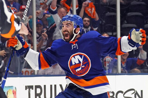 Boston Bruins' Brad Marchand (63) and David Krejci (46) react as the New York Islanders celebrate a goal by Cal Clutterbuck during the third period of Game 6 during an NHL hockey second-round playoff series Wednesday, June 9, 2021, in Uniondale, N.Y. The Islanders won 6-2. (AP Photo/Frank Franklin II)