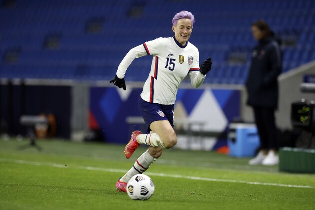 United States' Megan Rapinoe (15) runs to the ball during an international friendly women's soccer match between the United States and France in Le Havre, France, Tuesday, April 13, 2021. (AP Photo/David Vincent)