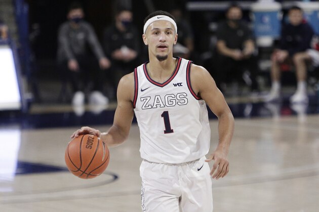 Gonzaga guard Jalen Suggs brings the ball up the court during the first half of an NCAA college basketball game against Saint Mary's in Spokane, Wash., Thursday, Feb. 18, 2021. (AP Photo/Young Kwak)
