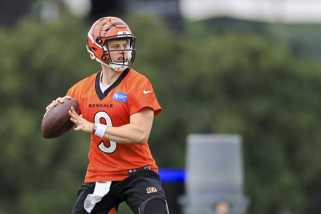 Cincinnati Bengals' Joe Burrow looks to pass during an NFL football camp practice in Cincinnati, Tuesday, June 8, 2021. (AP Photo/Aaron Doster)