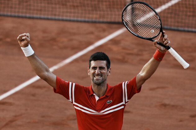 Serbia's Novak Djokovic celebrates defeating Stefanos Tsitsipas of Greece in their final match of the French Open tennis tournament at the Roland Garros stadium Sunday, June 13, 2021 in Paris. Djokovic won 6-7, 2-6, 6-3, 6-2, 6-4. (AP Photo/Thibault Camus)