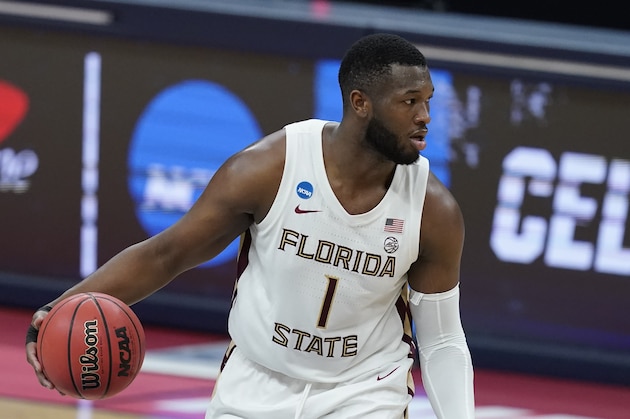 Florida State's RaiQuan Gray (1) dribbles during the first half of a first-round game against UNC-Greensboro in the NCAA men's college basketball tournament at Banker's Life Fieldhouse, Saturday, March 20, 2021, in Indianapolis. (AP Photo/Darron Cummings)