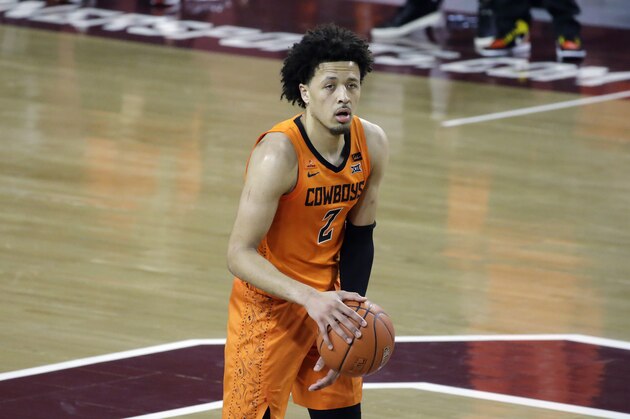 Oklahoma State guard Cade Cunningham (2) during the first half of an NCAA college basketball game against Oklahoma, Saturday, Feb. 27, 2021, in Norman, Okla. (AP Photo/Garett Fisbeck)