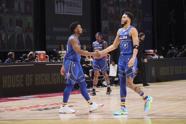 ATLANTA, GA - MARCH 7: Donovan Mitchell #45 of Team Durant high fives Jayson Tatum #0 of Team Durant during the 70th NBA All Star Game as part of 2021 NBA All Star Weekend on March 7, 2021 at State Farm Arena in Atlanta, Georgia. NOTE TO USER: User expressly acknowledges and agrees that, by downloading and or using this photograph, User is consenting to the terms and conditions of the Getty Images License Agreement. Mandatory Copyright Notice: Copyright 2021 NBAE (Photo by Nathaniel S. Butler/NBAE via Getty Images)