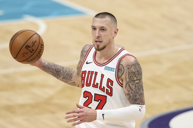 Chicago Bulls center Daniel Theis looks to pass against the Charlotte Hornets in the second half of an NBA basketball game against the Chicago Bulls in Charlotte, N.C., Thursday, May 6, 2021. Chicago won 120-99. (AP Photo/Nell Redmond)