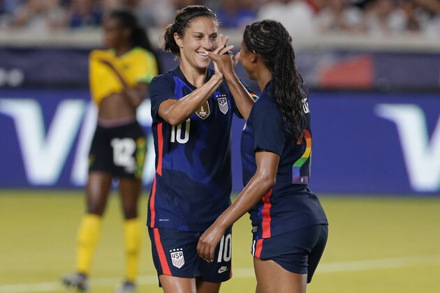 USA forwards Carli Lloyd (10) and Margaret Purce (20) celebrate Purce's goal during the first half of their 2021 WNT Summer Series match against Jamaica Sunday, June 13, 2021, in Houston. (AP Photo/Michael Wyke)