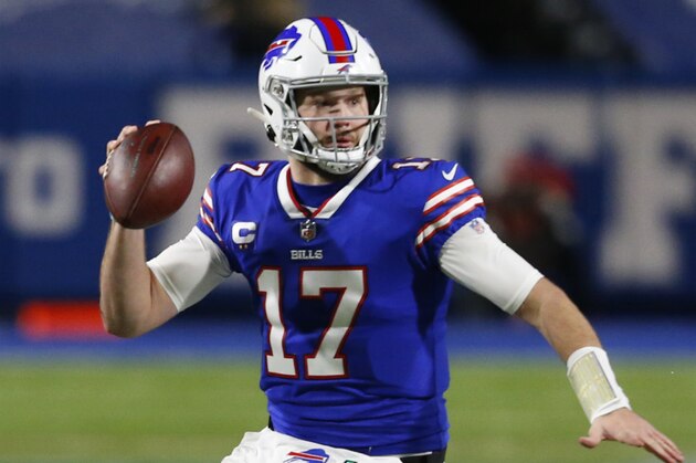 Buffalo Bills quarterback Josh Allen (17) carries the ball during the first half of an NFL football game against the Baltimore Ravens in Orchard park, N.Y., Saturday Jan. 16, 2021. (AP/ Photo Jeffrey T. Barnes)