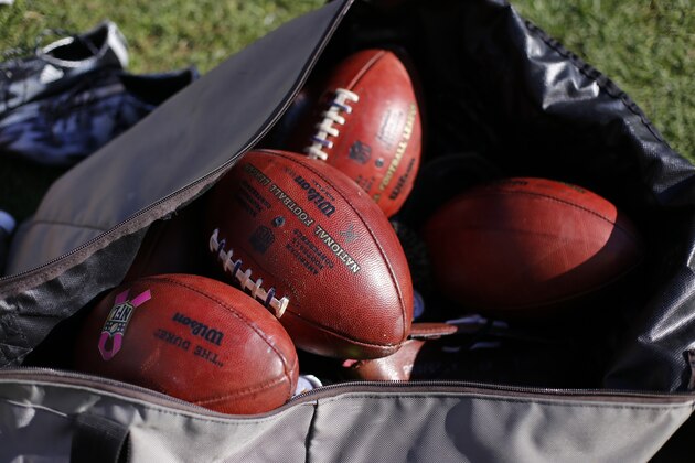 A bag of NFL Wilson footballs sits on the sidelines before an NFL football game between the Pittsburgh Steelers and the Oakland Raiders in Pittsburgh, Sunday, Nov. 8, 2015. (AP Photo/Gene J. Puskar)